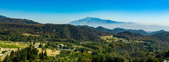 Aerial, drone view of Oak Glen located between the San Bernardino Mountains and Little San...