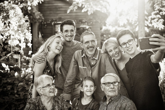 During A Bbq A Teenager Does A Selfie With The Whole Family