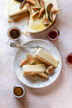 Overhead view of ricotta cheesecake with figs served on plate