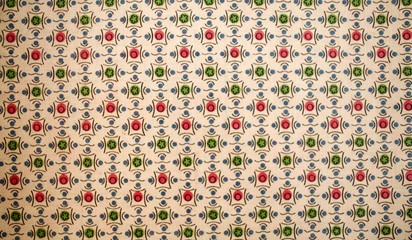 Fragment of colorful retro tapestry text. Fabric striped, flowered texture.