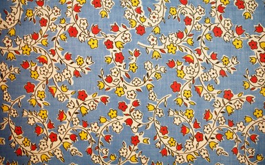 Fragment of colorful retro tapestry text. Fabric striped, flowered texture.