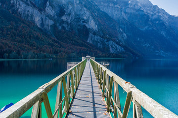bridge over lake leading the way