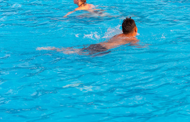 people swimming in the pool