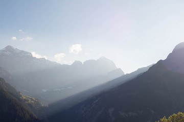 panoramic view of the mountains with blue layers and fog