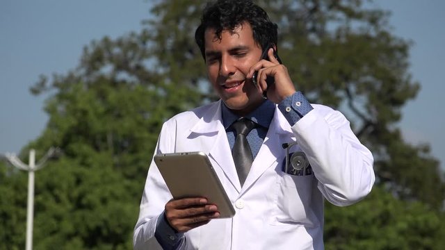 Happy Hispanic Doctor Diagnosis Using Tablet