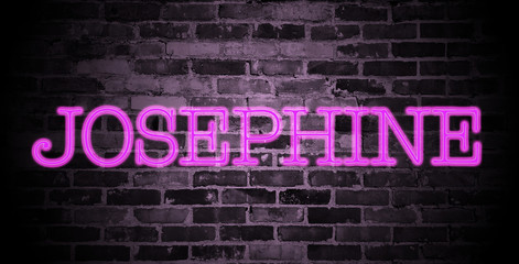 Fototapeta na wymiar first name Josephine in pink neon on brick wall