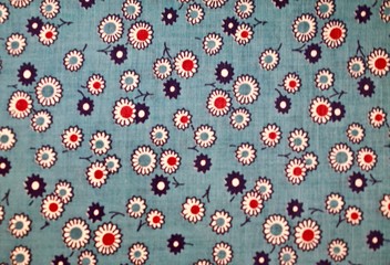 Fragment of colorful retro tapestry text. Fabric striped, flowered texture.