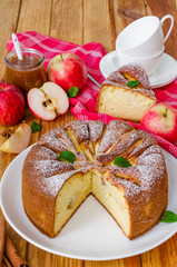 Delicious apple pie with cinnamon and caramel sauce. Traditional cake Charlotte.