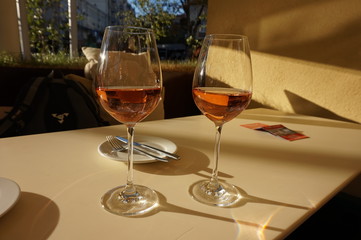 Two glasses of rose wine in the restaurant. Romantic lunch.