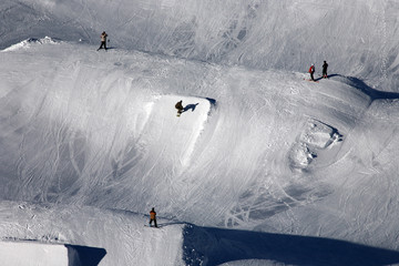 snowboarders in the mountains