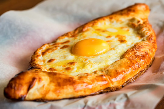 Ajarian khachapuri Georgian cheese pie with egg close