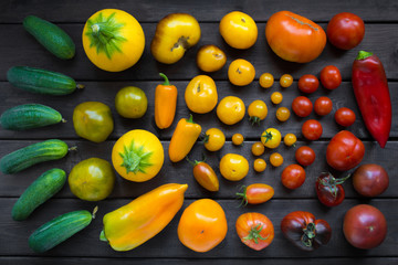 different varieties of vegetables the color of traffic lights - tomatoes, cucumbers, peppers, zucchini, top view