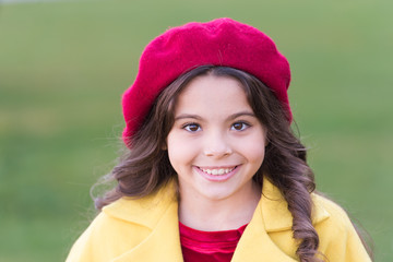 Kid girl bright hat beret long curly hair. Fall hat fashion accessory. French trend fall season. Charming french style fashionable girl. Fall fashion concept. Hat accessory french fashion detail