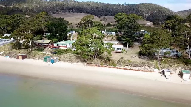 Drone shot of Boat sheds off a beach located on Bruney Island, Tasmania.