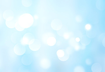 Light blue blurred abstract bokeh background.