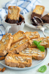  Light almond cookie and a cup with chocolate.