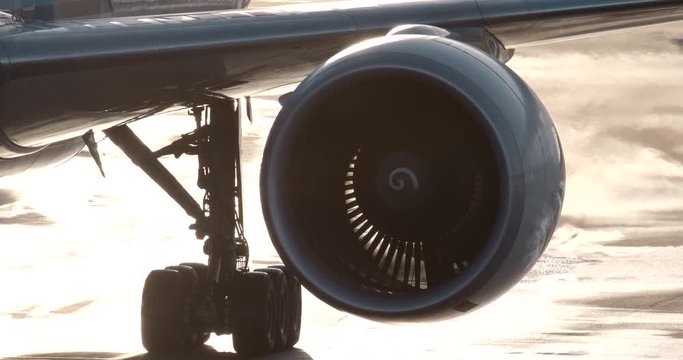 Modern Aircraft Engine Running Close Up while taxing