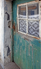 door detail of old, historic, traditional home with stencils of whales for decoration, near former whale factory, Horta, Faial Island, Azores, Portugal