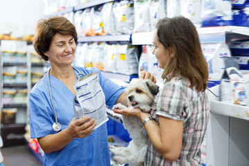 Cheerful veterinary consulting female client