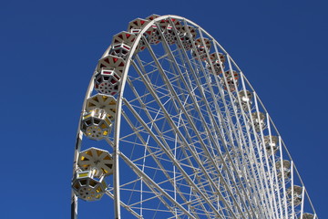 Ferris wheel against blue sky