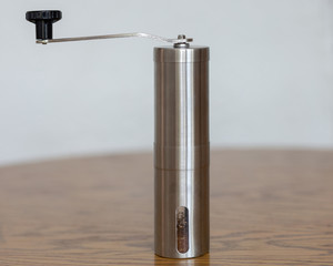 Coffee grinder on the table. White background.