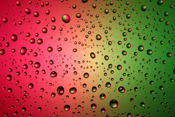 Texture and background of drops of water on a colored background