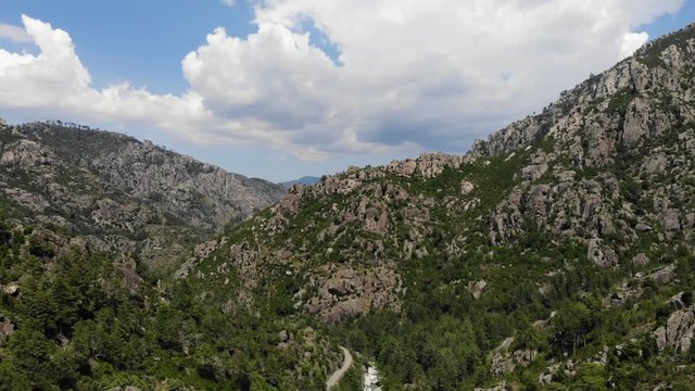 Descending Drone Footage of a River in the Mountains of Corsica, France