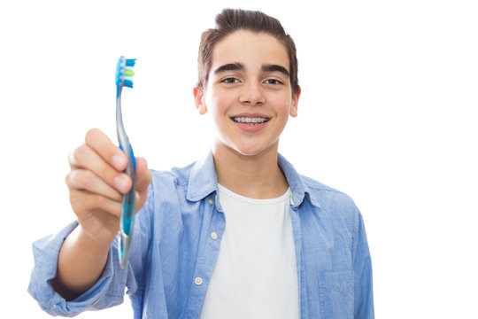 young teenager with orthodontics and dental toothbrush, braces