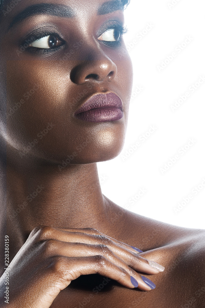 Wall mural young beautiful black woman with clean perfect skin makeup