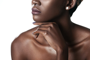 Palm and lips of young beautiful black woman with clean perfect skin close-up