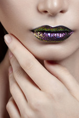 Fototapeta premium Young beautiful girl with purple make-up