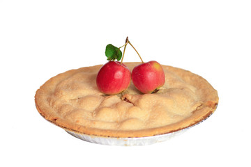 Delicious baked apple pie displayed with fresh crab apples isolated on a white background