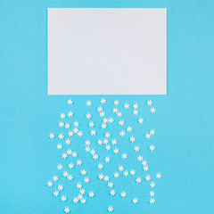 Winter pattern made of small white snowflakes