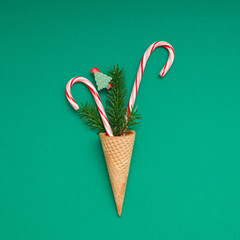 Christmas card with candy canes in waffle cone
