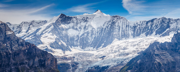 Great view of the massive rock in snow sunlight. Location Swiss alps, Grindelwald valley.