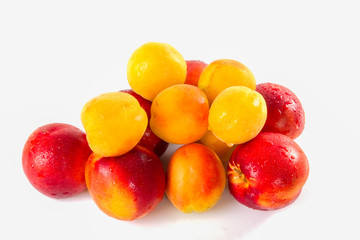 Apricots, nectarines super fruit, high energy antioxidant food, health booster. Juicy meiterranean apricots and nectarines isolated on white background.