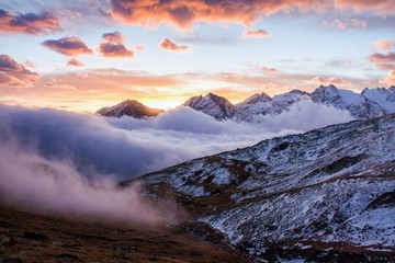Great view of the foggy valley in Gran Paradiso National Park,  Alps, Italy,  dramatic scene, beautiful world. colourful autumn morning,scenic view with cloudy sky, majestic dawn in mountain landscape