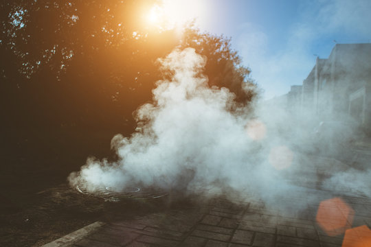 Accident On The Heating Line Under The Ground - Thick Steam From Under The Sewer Manhole