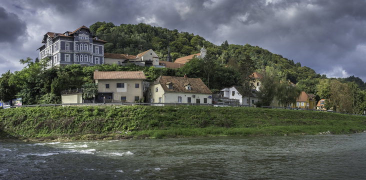 River Savinja, houses in Breg and town park in Celje, Slovenia