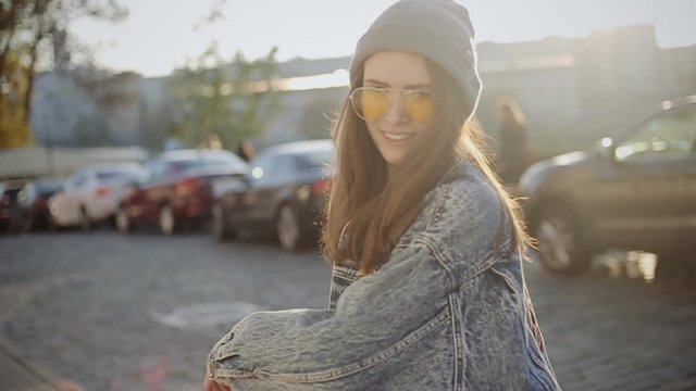 Pretty cool hipster girl posing in the city, slow motion