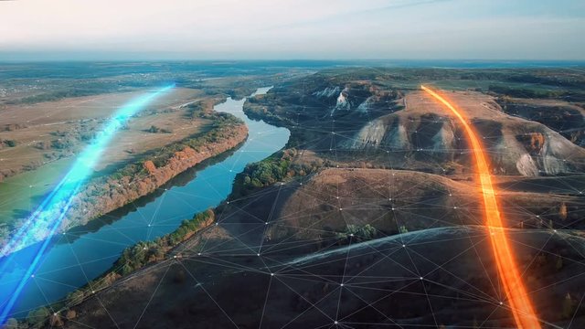 4k Aerial view The concept of disseminating information, data flows over a natural landscape with a river and mountains