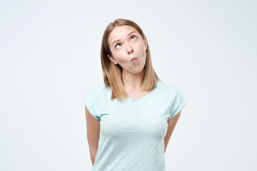 Fototapeta premium Gorgeous caucasian woman pretends to be kissing doing fish face