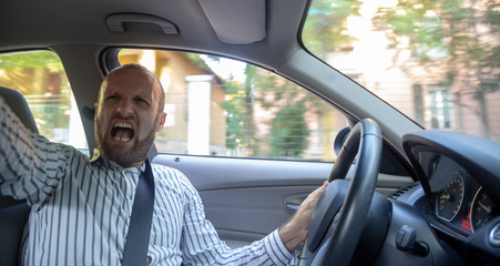 Aggressive and crazy driver in his car