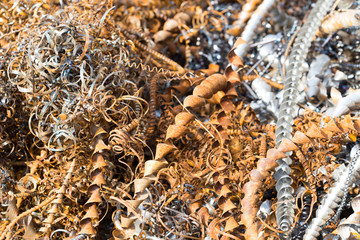 silver spirals of metal shavings as garbage, texture of different size of metal spirals shavings texture, metal shavings texture