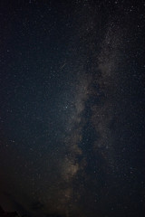 Clouds in the moonlight against the milky way summer night