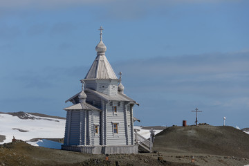 Wooden church in Antarctica on Bellingshausen Russian Antarctic research station and helicopter © Alexey Seafarer