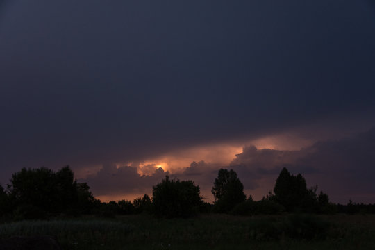 Lightning on a summer night over the forest