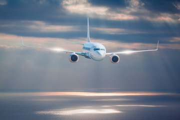 Fototapeta premium Passenger airplane in the clouds. travel by air transport