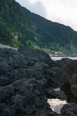 Beautiful black rock beach in Seixal, Madeira with waves crashing