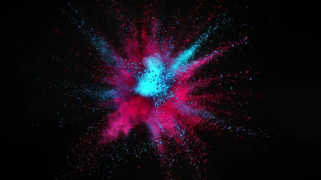 Super slow motion of coloured powder explosion isolated on black background. Filmed on high speed cinema camera, 1000fps.